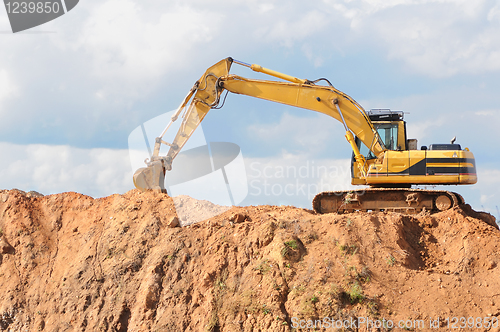 Image of track-type loader excavator at construction area