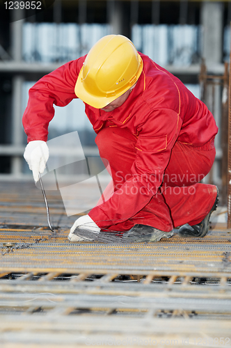 Image of construction worker making reinforcement