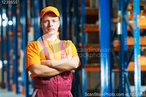 Image of caucasian young manual worker in warehouse