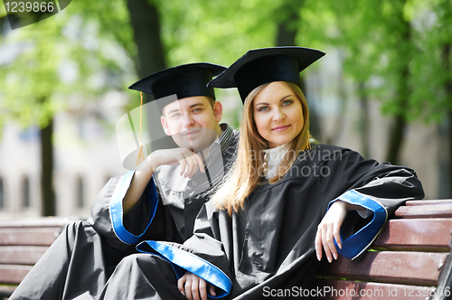 Image of happy graduate students outdoors