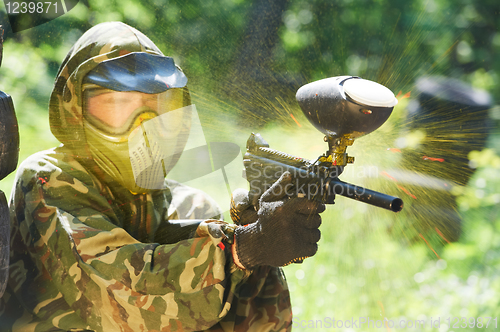 Image of paintball player direct hit