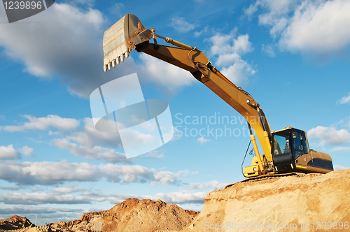 Image of track-type loader excavator at construction area