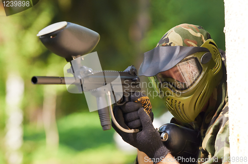 Image of paintball player holding fire