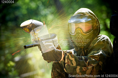 Image of paintball player direct hit