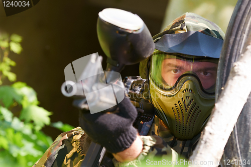 Image of paintball player with gun