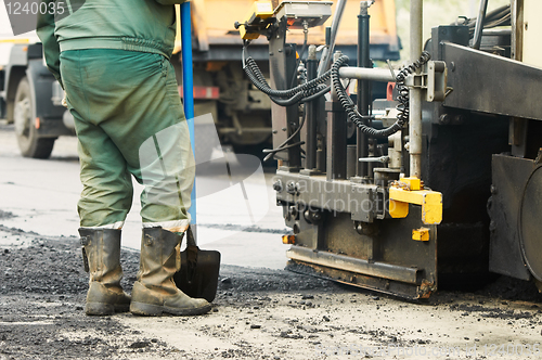 Image of worker at asphalting works