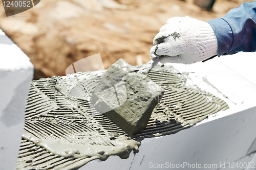 Image of construction mason bricklaying work