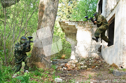 Image of paintball player under attack