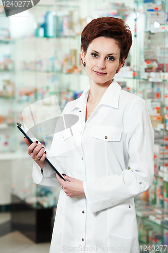 Image of Pharmacy chemist woman in drugstore