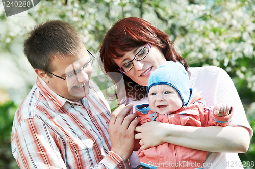 Image of happy family at spring outdoors