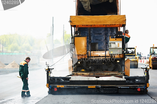 Image of worker at asphalting works