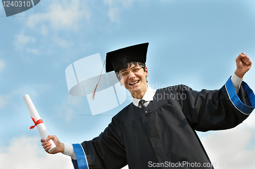 Image of Happy graduate student in gown