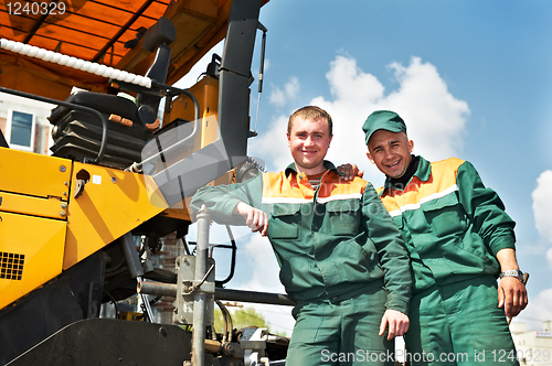 Image of two asphalt workers