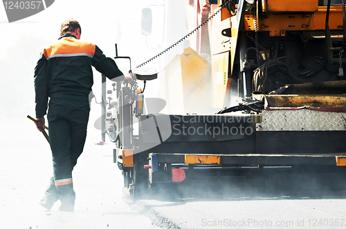 Image of worker at asphalting works