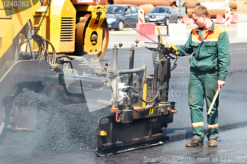 Image of worker at asphalting works