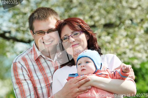 Image of happy family at spring outdoors