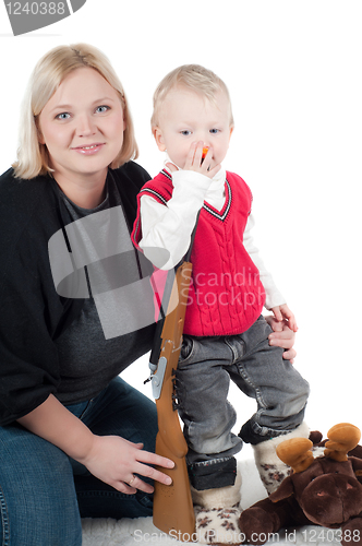 Image of Little boy playing with gun