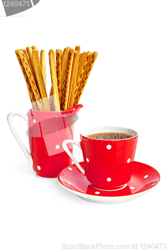 Image of Bread sticks and coffee in the red utensil