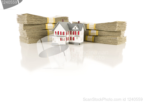 Image of Stacks of Hundreds with Small House