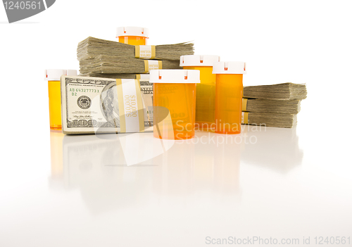 Image of Medicine Bottles and Stacks of Hundreds of Dollars