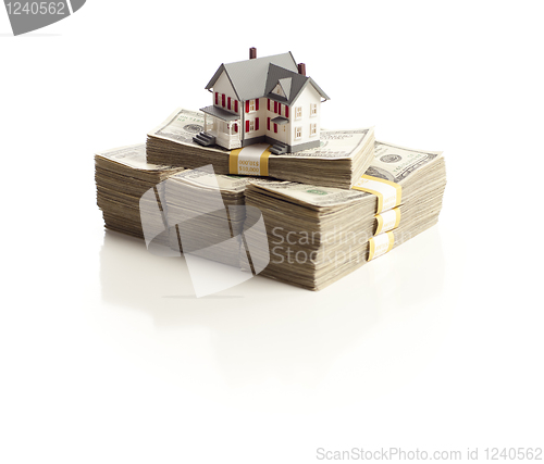 Image of Small House on Stacks of Hundred Dollar Bills