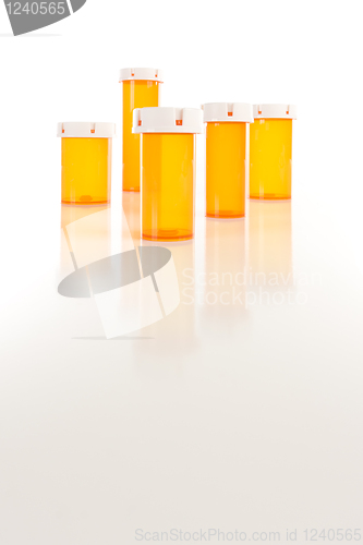 Image of Empty Medicine Bottles on Reflective Surface