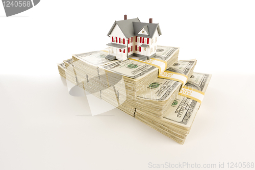 Image of Small House on Stacks of Hundred Dollar Bills