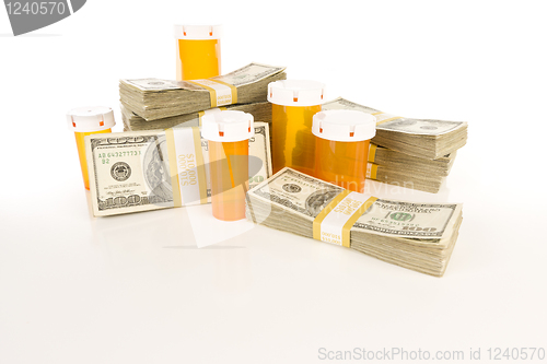 Image of Medicine Bottles and Stacks of Hundreds of Dollars