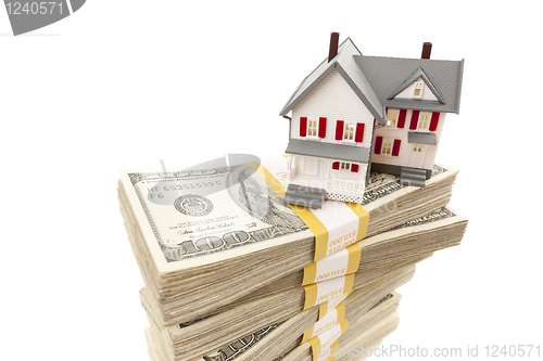 Image of Small House on Stacks of Hundred Dollar Bills