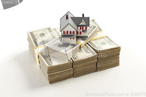 Image of Small House on Stacks of Hundred Dollar Bills