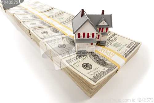 Image of Small House on Stacks of Hundred Dollar Bills