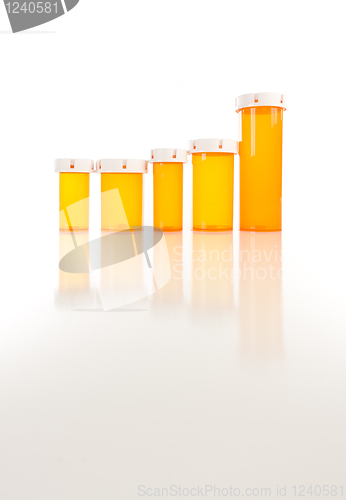 Image of Empty Medicine Bottles on Reflective Surface