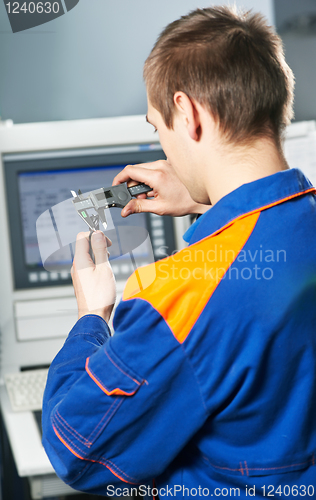 Image of worker at tool workshop