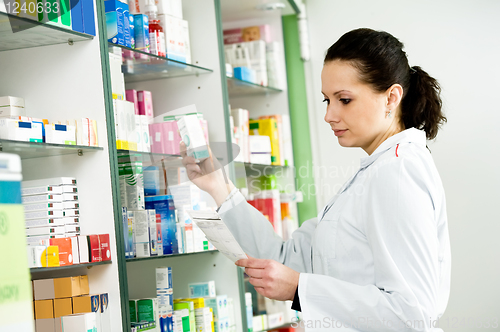 Image of Pharmacy chemist woman in drugstore