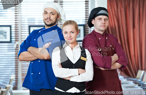 Image of restaurant administrator and chefs