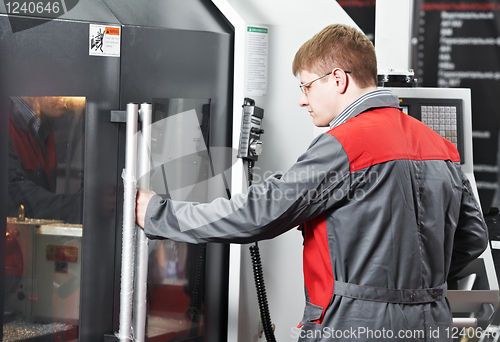 Image of worker at machining tool workshop