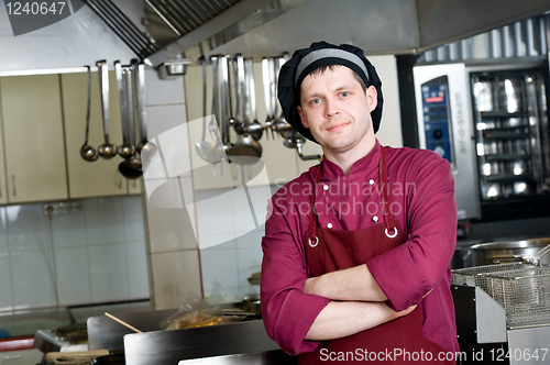 Image of chef in uniform at kitchen