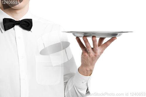 Image of Waiter hand with metal plate