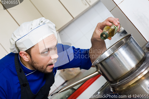 Image of chef cooking a soup