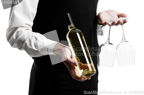 Image of Waiter sommelier with wine bottle and stemware