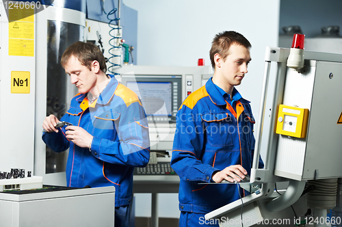 Image of two workers at tool workshop