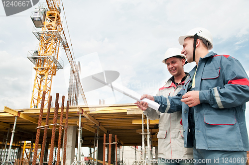 Image of Engineers builders at construction site