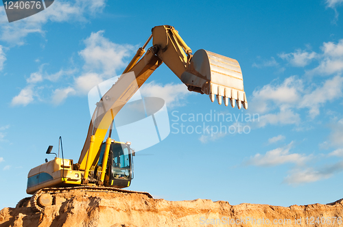 Image of track-type loader excavator at construction area