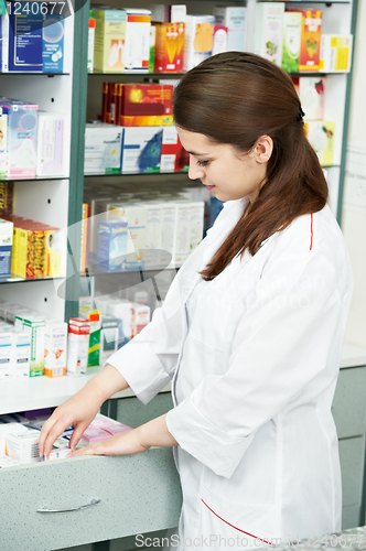 Image of Pharmacy chemist woman in drugstore