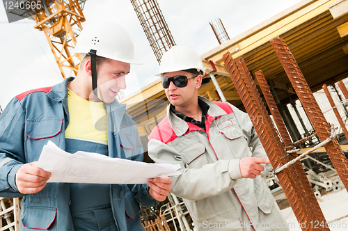 Image of Engineers builders at construction site