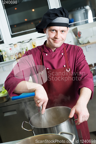 Image of chef making sauce