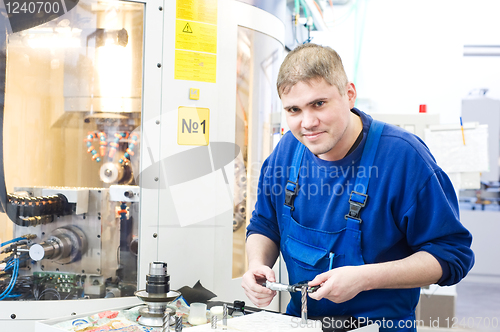 Image of worker measuring detail