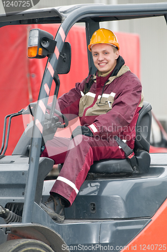 Image of warehouse worker driver in  forklift