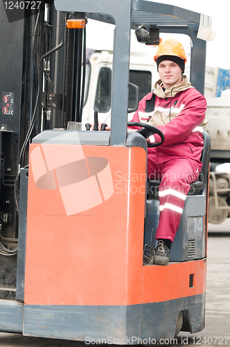 Image of warehouse worker in stacker