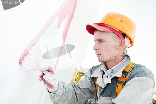 Image of builder facade painter at work